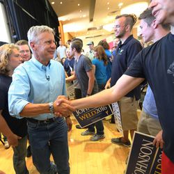 After the rally in the Student Union Building at the University of Utah in Salt Lake City, Libertarian presidential candidate Gov. Gary Johnson shakes hands as he and running mate Gov. Bill Weld exit on Saturday, Aug. 6, 2016.