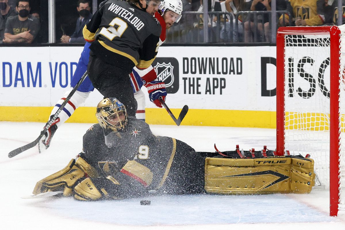 The puck gets away from Marc-Andre Fleury #29 of the Vegas Golden Knights after he made a save against Josh Anderson #17 of the Montreal Canadiens as Zach Whitecloud #2 of the Golden Knights defends in the first period in Game 5 of the Stanley Cup Semifinals of the 2021 Stanley Cup Playoffs at T-Mobile Arena on June 22, 2021 in Las Vegas, Nevada.