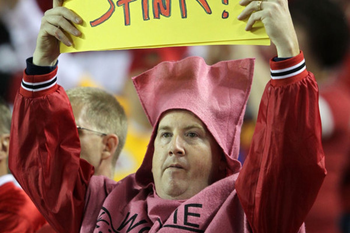 KANSAS CITY, MO:  A fan dressed for Halloween holds a sign during the game between the San Diego Chargers and the Kansas City Chiefs at Arrowhead Stadium in Kansas City, Missouri.  (Photo by Jamie Squire/Getty Images)