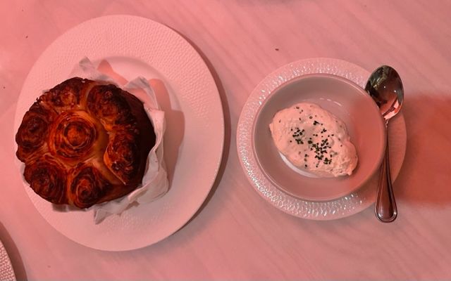 What looks like monkey bread with a quenelle of fresh cream.