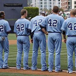 Atlanta Braves players line up before the start of a baseball game against the San Diego Padres in 2010, wearing No. 42 in honor of Jackie Robinson.