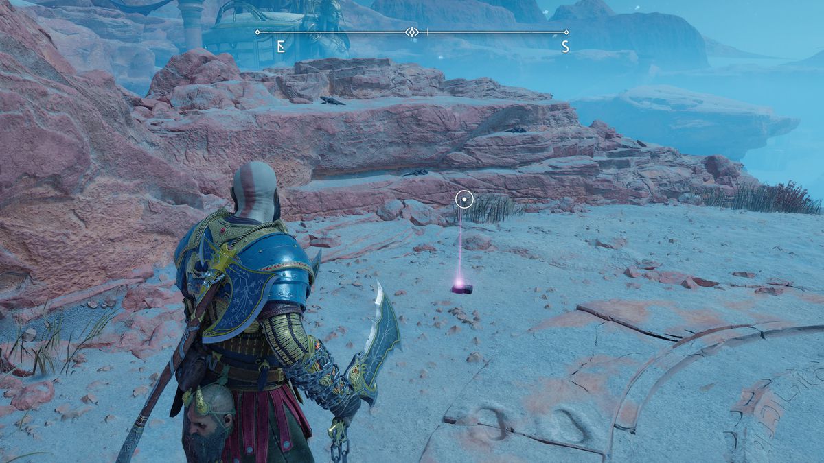 Kratos grabs an Artifact off the ground