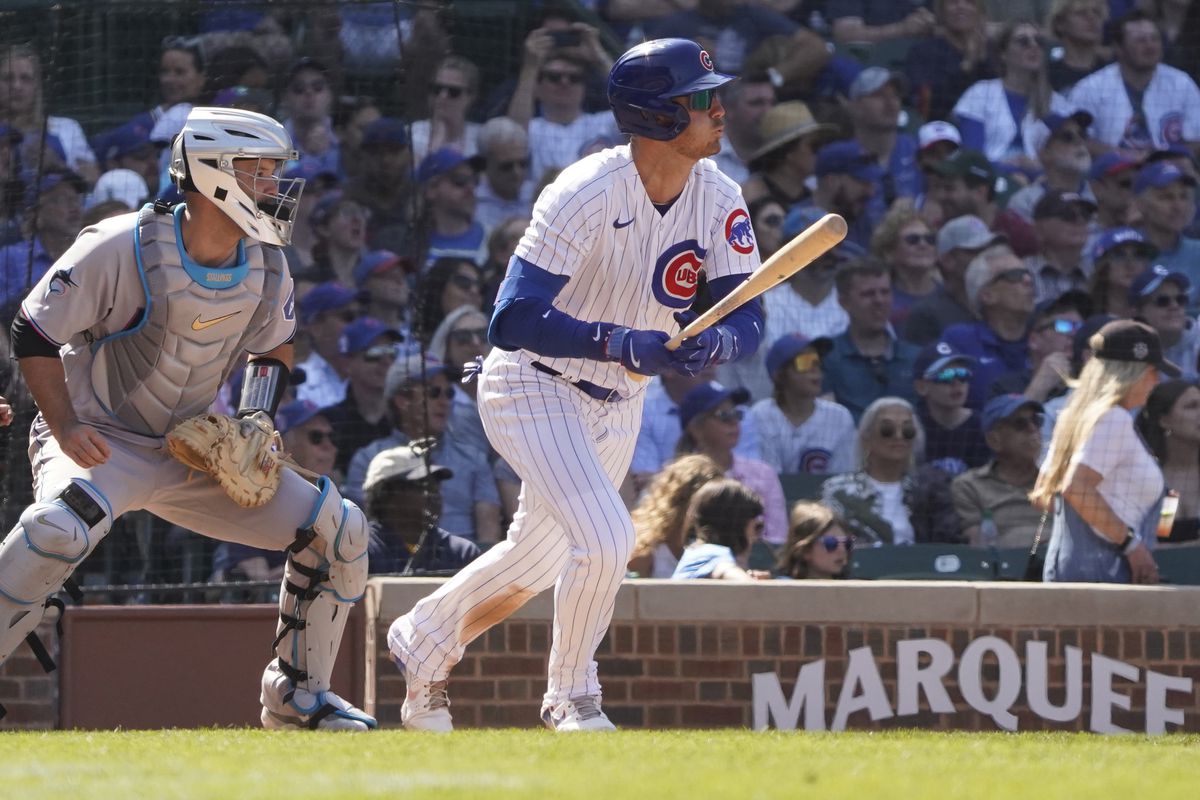 Chicago Cubs center fielder Cody Bellinger hits a one run double during the ninth inning against the Miami Marlins at Wrigley Field.