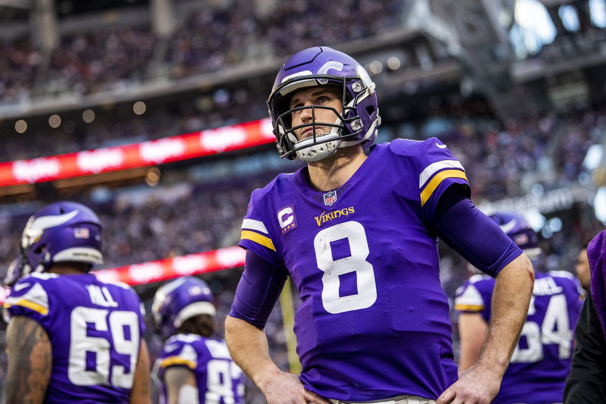 Kirk Cousins #8 of the Minnesota Vikings stands on the sidelines in the third quarter of the game against the Chicago Bears at U.S. Bank Stadium on January 9, 2022 in Minneapolis, Minnesota.