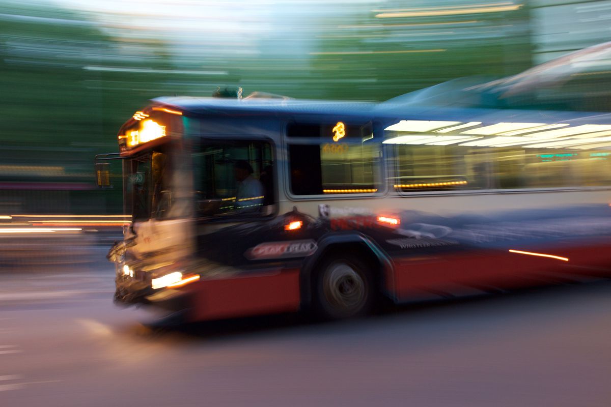Blurry photo of a Number 3 bus at night