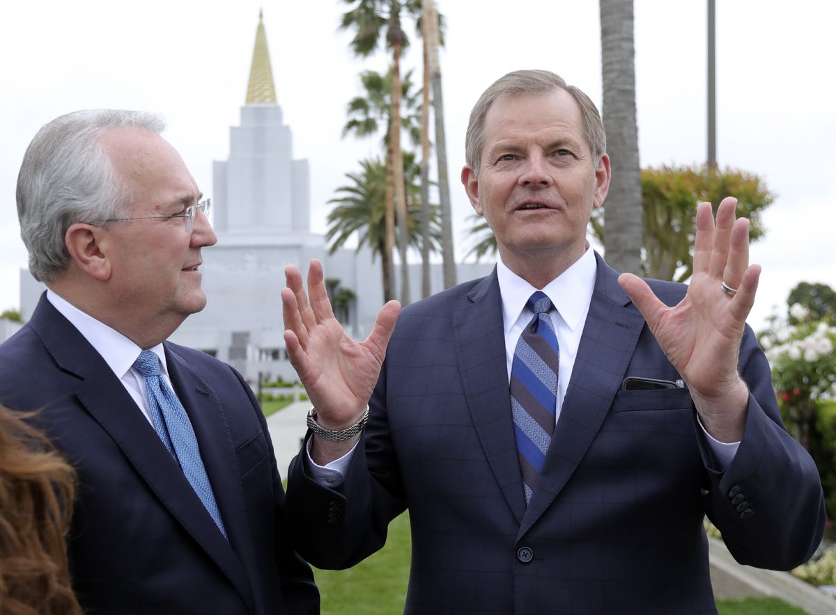 Elder Jack N. Gerard, General Authority Seventy, and Elder Gary E. Stevenson, of the Quorum of the Twelve Apostles, talk to members of the media outside of the newly renovated Oakland California Temple, of The Church of Jesus Christ of Latter-day Saints, 