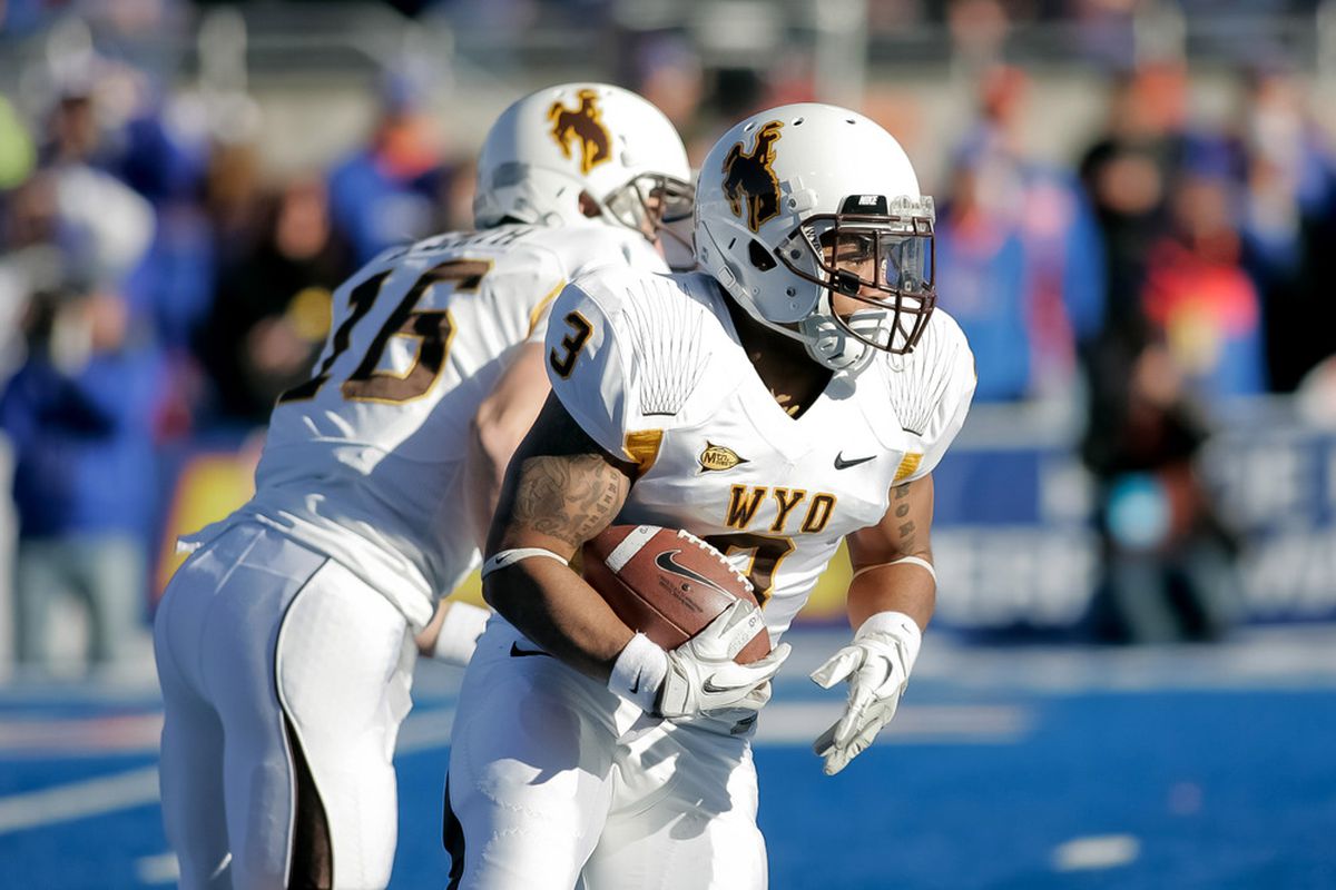BOISE, ID - NOVEMBER 26: Kody Sutton #3 of the Wyoming Cowboys runs the ball against the Boise State Broncos at Bronco Stadium on November 26, 2011 in Boise, Idaho.  (Photo by Otto Kitsinger III/Getty Images)