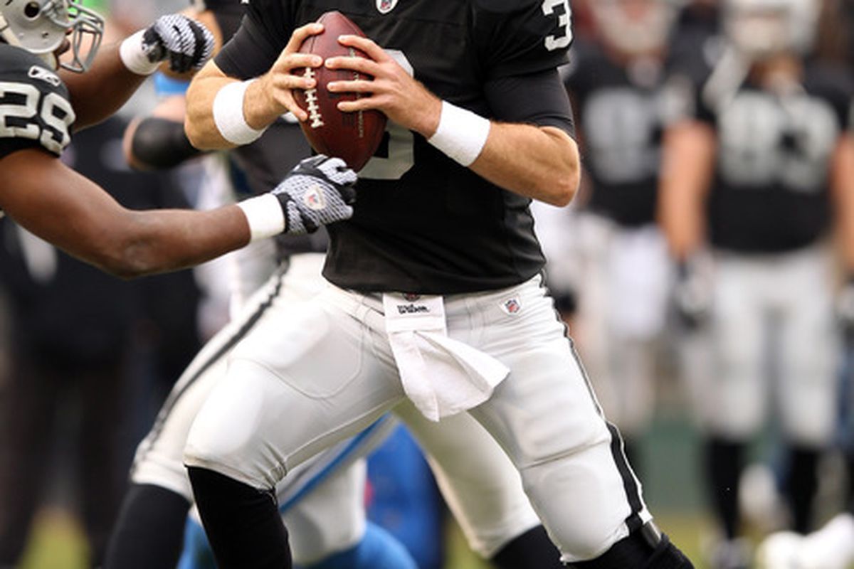 OAKLAND, CA - DECEMBER 18:  Carson Palmer #3 of the Oakland Raiders drops back to pass against the Detroit Lions at O.co Coliseum on December 18, 2011 in Oakland, California.  (Photo by Ezra Shaw/Getty Images)