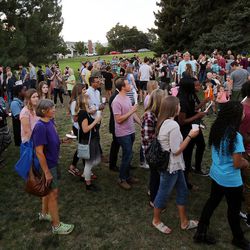 Students and community members join in a march sining "We shall overcome" as they attend a solidarity vigil to stand against white supremacy and racism hosted by BYU college Republican and Democrat clubs in Provo on Sunday, Aug. 20, 2017.