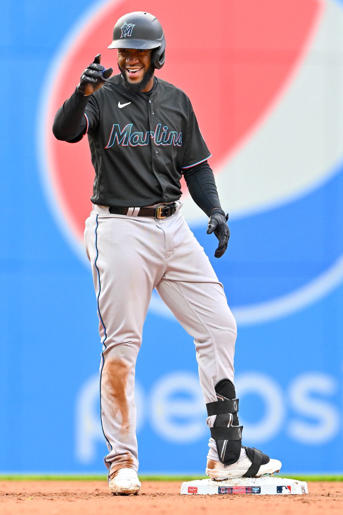 Bryan De La Cruz #14 of the Miami Marlins celebrates after hitting a double during the seventh inning of the first game of a doubleheader against the Cleveland Guardians at Progressive Field on April 22, 2023 in Cleveland, Ohio.
