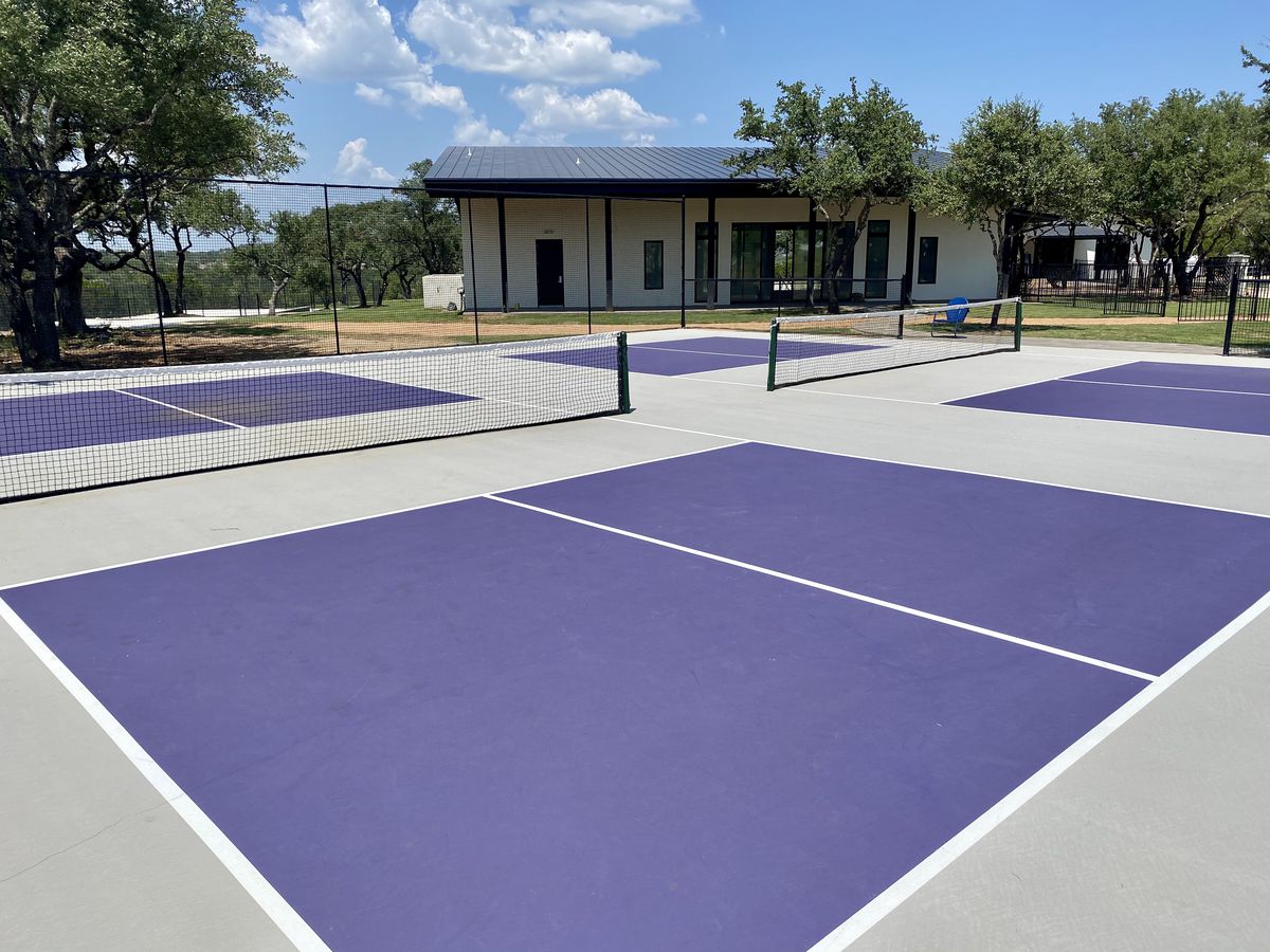 Purple pickleball courts with nets