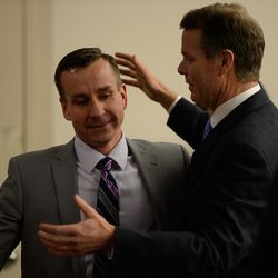 Former Utah Attorney General John Swallow hugs defense attorney Brad Anderson after he was found not guilty on all charges in his public corruption trial at the Matheson Courthouse in Salt Lake City on Thursday March 2, 2017.