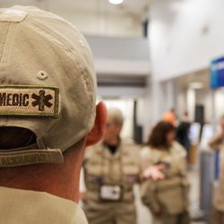 A “paramedic” badge on Barrett Raymond's hat is pictured at the Salt Lake City International Airport on Tuesday, Aug. 29, 2017, as he and other members of Utah's Disaster Medical Assistance Team prepare to depart for Texas to aid in Hurricane Harvey relief efforts. The team's 36 members consist of physicians, nurses, paramedics, emergency medical technicians and other medical specialists.