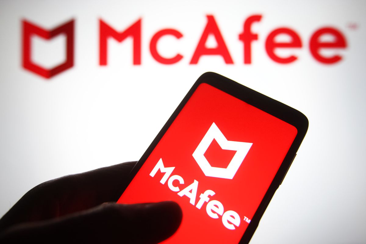In this photo illustration, a McAfee Corp. logo is seen on a smartphone screen