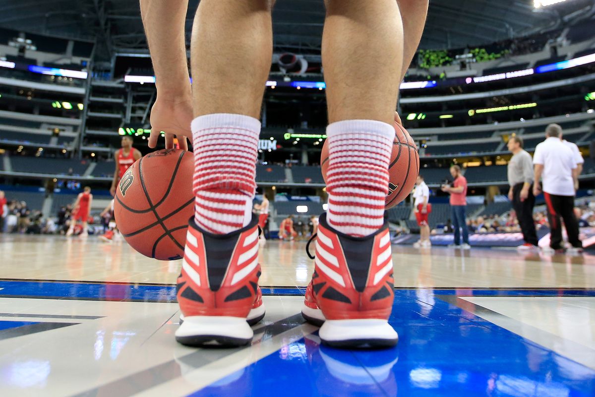 ARLINGTON, TX - APRIL 04: Traevon Jackson #12 of the Wisconsin Badgers dribbles the ball as the Badgers practice ahead of the 2014 NCAA Men's Final Four at AT&T Stadium on April 4, 2014 in Arlington, Texas.