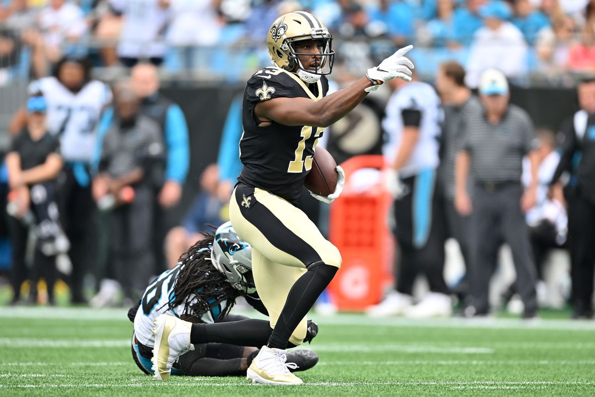 Michael Thomas of the New Orleans Saints reacts after making a catch for a first down against the Carolina Panthers during the first quarter at Bank of America Stadium on September 25, 2022 in Charlotte, North Carolina.