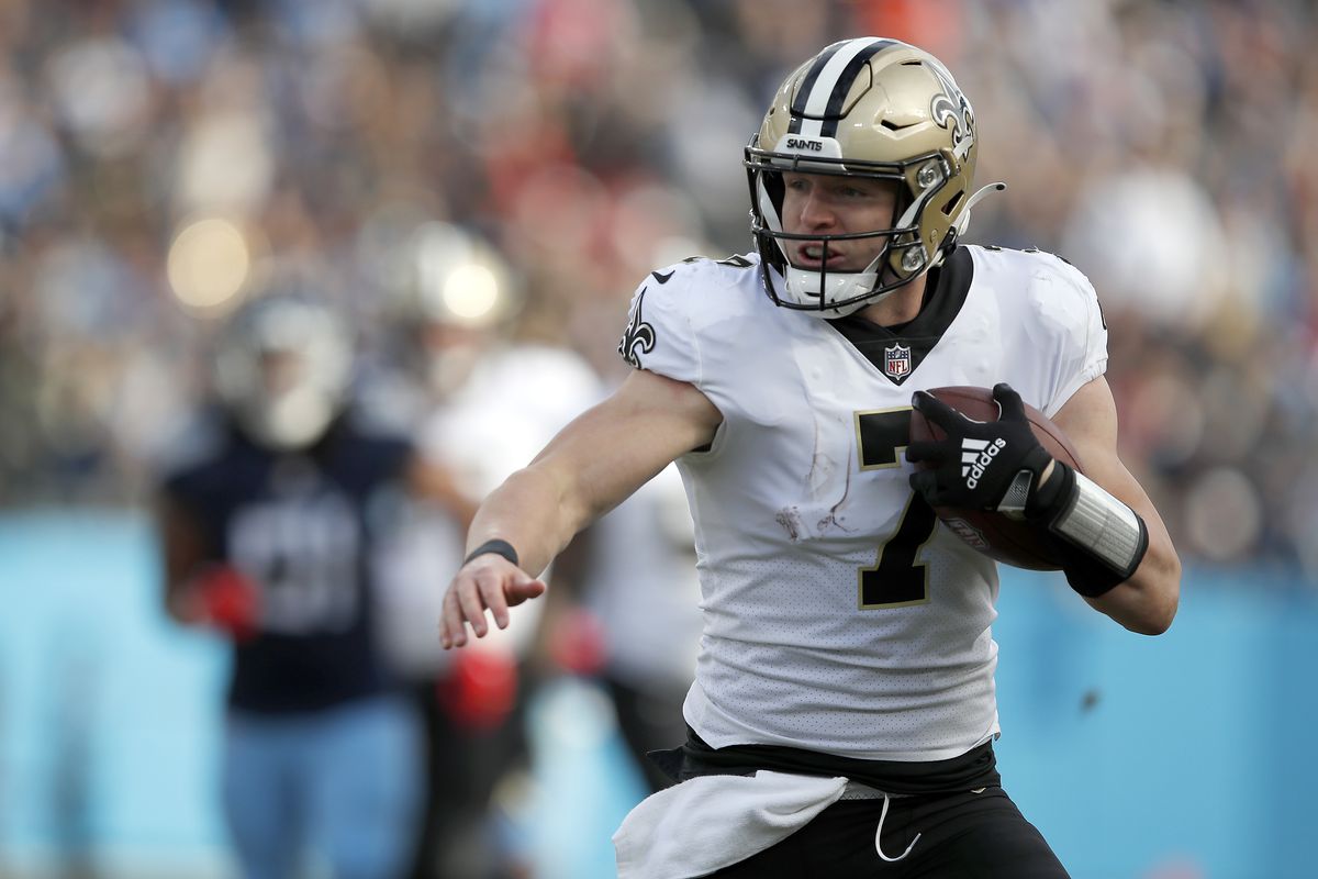 Taysom Hill #7 of the New Orleans Saints runs with the ball against the Tennessee Titans in the second half of the game at Nissan Stadium on November 14, 2021 in Nashville, Tennessee.