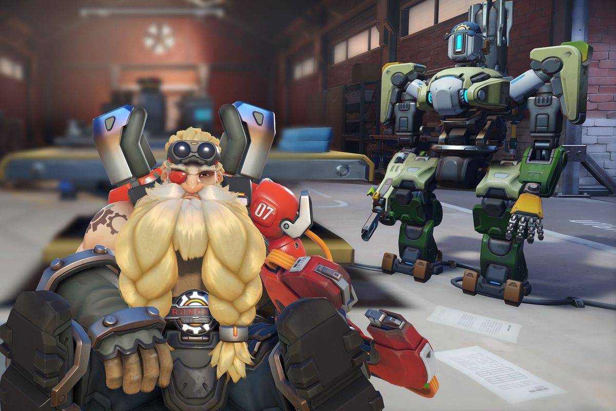Overwatch’s Bastion and Torbjörn characters appear in a warehouse under the slogan ‘Back to the shop for some quick repairs’