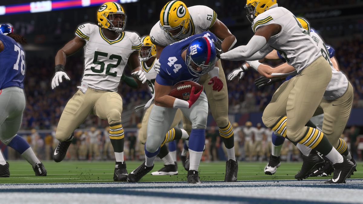 a swarm of Green Bay defenders takes down a runner too late to prevent a touchdown