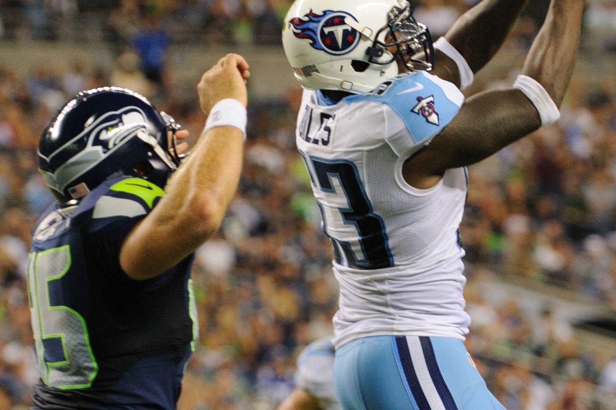 Aug 11, 2012; Seattle, WA, USA; Tennessee Titans linebacker Zac Diles (53) makes an interception in the Seattle Seahawks endzone during the 2nd half at CenturyLink Field. Seattle defeated Tennessee 27-17. Mandatory Credit: Steven Bisig-US PRESSWIRE
