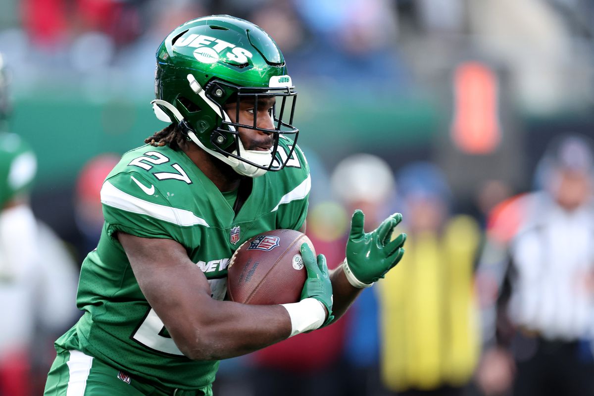 Zonovan Knight #27 of the New York Jets runs with the ball during the second half against the Detroit Lions at MetLife Stadium on December 18, 2022 in East Rutherford, New Jersey.