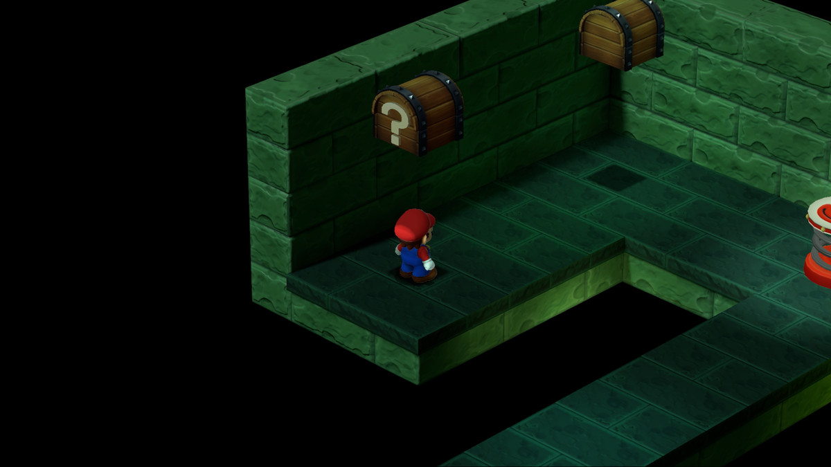 Mario stands in the middle of a stone underground path in Super Mario RPG.