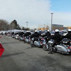 The procession leaves the Dee Events Center in Ogden on Wednesday, Nov. 30, 2016, following the funeral for Utah Highway Patrol trooper Eric Ellsworth.