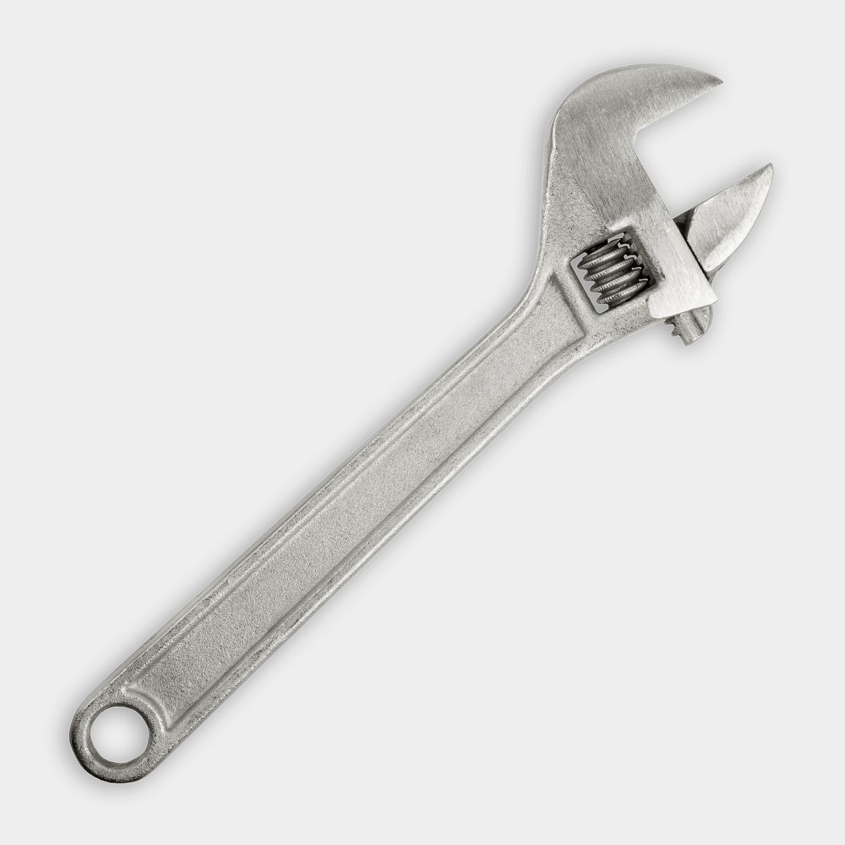 adjustable wrench on grey background