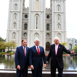 Indiana Gov. and GOP vice presidential nominee Mike Pence, center, poses for a photo with Utah Gov. Gary Herbert, left, and U.S. Sen. Orrin Hatch, R-Utah, in Salt Lake City, Thursday, Sept. 1, 2016. In the background is the Salt Lake City Temple of The Church of Jesus Christ of Latter-day Saints.