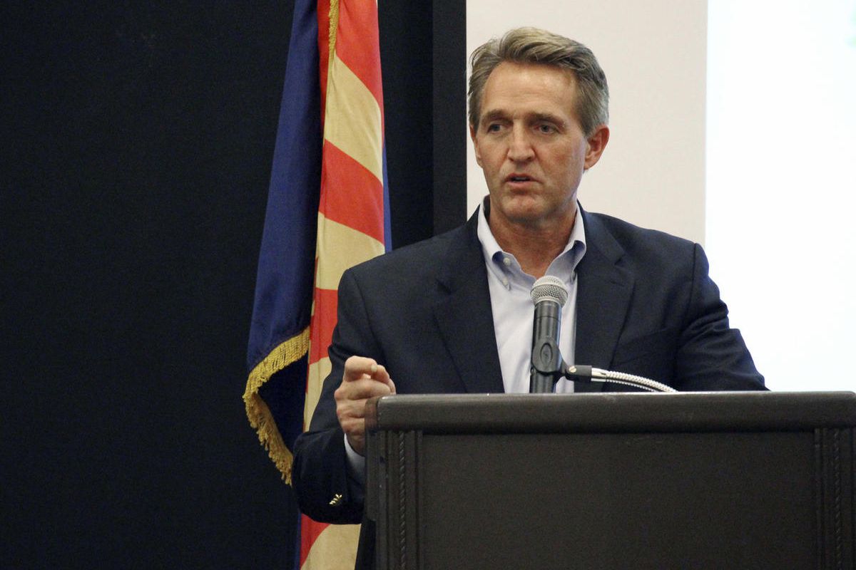 U.S. Sen. Jeff Flake addresses business officials gathered for an event in Prescott, Ariz., Thursday, Aug. 10, 2017. Flake told the group that that the new administration is restoring the balance on environmental regulations from what he called the one-si