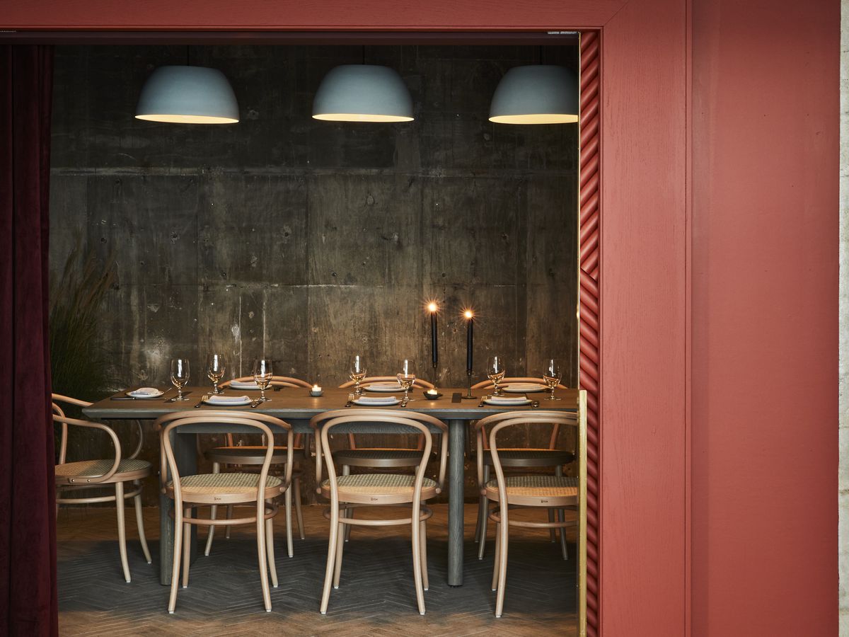 The private dining zone at Kimika is hidden behind an orange curtain.