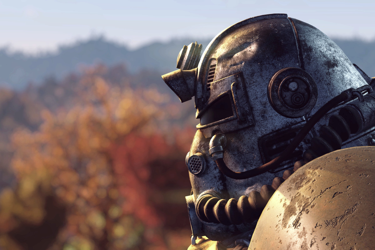 Fallout 76 - profile of power armor helmet with autumn trees in the background