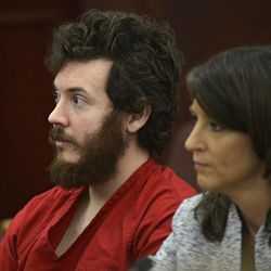 FILE - In this March 12, 2013 file photo, James Holmes, left, and defense attorney Tamara Brady appear in district court in Centennial, Colo. for his arraignment. Court documents are raising new questions for the university that Colorado theater shooting suspect James Holmes attended before the July 20 theater shooting that left 12 people dead and 70 injured. 