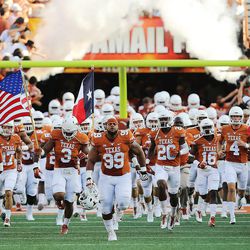 Texas runs onto the field as BYU and Texas play Saturday, Sept. 6, 2014, in Austin, Texas.