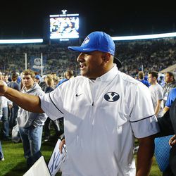 Brigham Young Cougars head coach Kalani Sitake greets fans after his team defeated Mississippi State 28-21 in overtime in Provo at LaVell Edwards Stadium on Friday, Oct. 14, 2016.