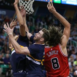 Utah Jazz center Rudy Gobert (27) and forward Gordon Hayward (20) and Chicago Bulls center Robin Lopez (8) compete for a rebound during a game at Vivint Arena in Salt Lake City Thursday, Nov. 17, 2016.