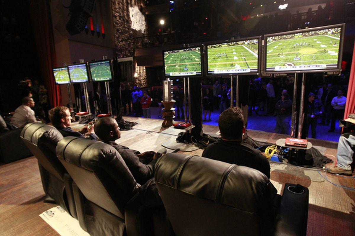 GRAPEVINE TX - FEBRUARY 03: Chase Daniel Reggie Bush and Drew Brees of the New Orleans Saints compete in the EA Sports Madden Bowl XVII on February 3 2011 in Grapevine Texas.  (Photo by Tom Pennington/Getty Images for EA Sports)