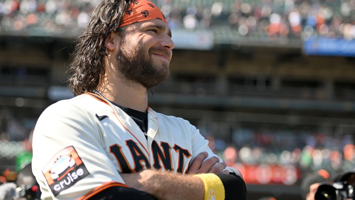 Brandon Crawford of the San Francisco Giants smiles while watching a historical playback of his after a baseball game against the Los Angeles Dodgers at Oracle Park on October 1, 2023 in San Francisco, California.