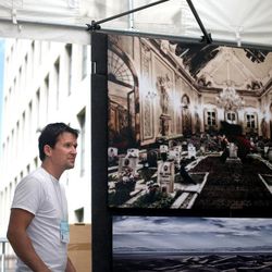 Andrew Mosedale of Santa Barbara, Calif., hangs his photographs in preparation for this weekend's Utah Arts Festival in Salt Lake City on Wednesday, June 19, 2013. The festival runs June 20-23 at Library Square in Salt Lake City.