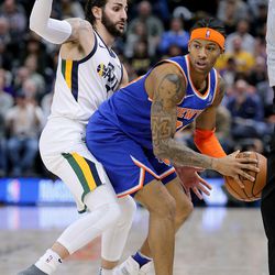 New York Knicks guard Trey Burke (23) looks to make a pass around Utah Jazz guard Ricky Rubio (3) during a basketball game at the Vivint Smart Home Arena in Salt Lake City on Friday, Jan. 19, 2018.
