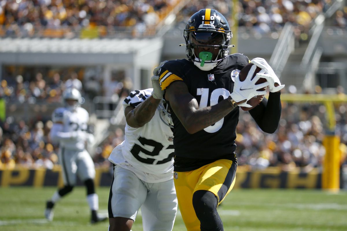 Wide receiver Diontae Johnson #18 of the Pittsburgh Steelers makes a catch against cornerback Trayvon Mullen Jr. #27 of the Las Vegas Raiders in the first half of the game at Heinz Field on September 19, 2021 in Pittsburgh, Pennsylvania.