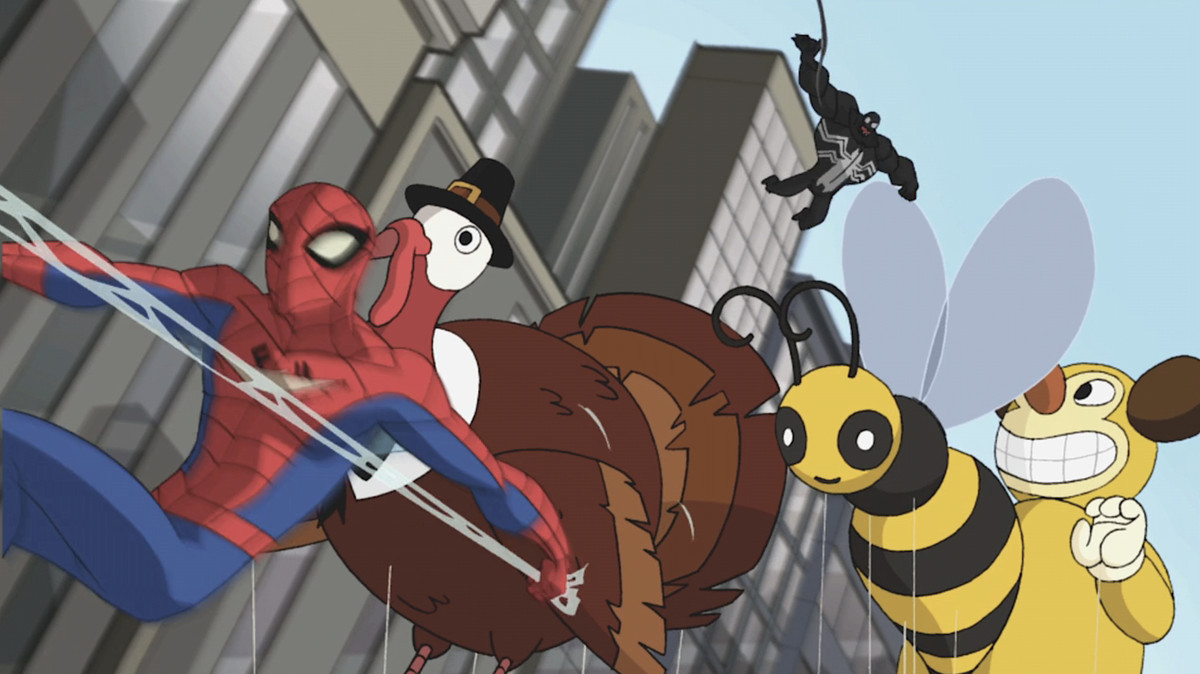Spider-Man, in a blur of motion, goes whipping by a Thanksgiving Day parade balloon of a turkey in a pilgrim hat, as a surprisingly chubby Venom pursues him in the Spectacular Spider-Man episode “Nature Vs. Nurture”