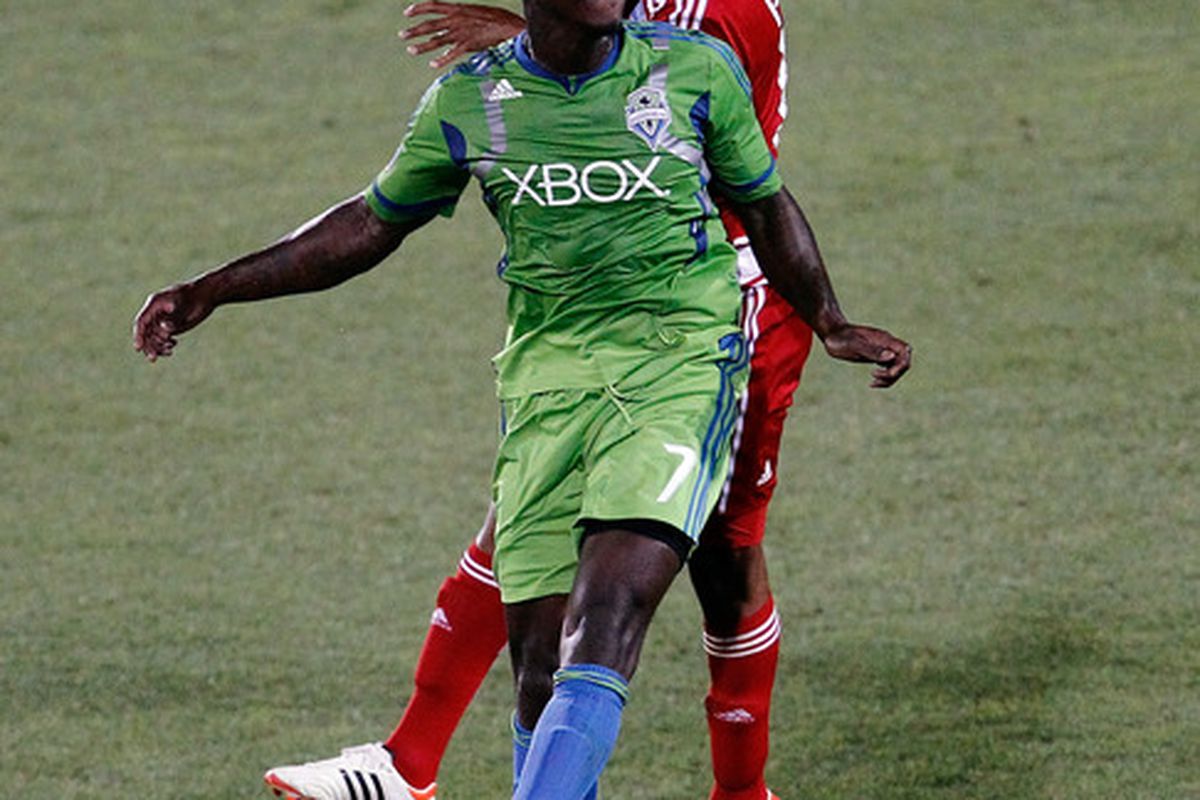 FRISCO, TX - MAY 09:  Eddie Johnson #7 of the Seattle Sounders FC heads the ball against Hernan Pertuz #13 of the FC Dallas at FC Dallas Stadium on May 9, 2012 in Frisco, Texas.  (Photo by Tom Pennington/Getty Images)