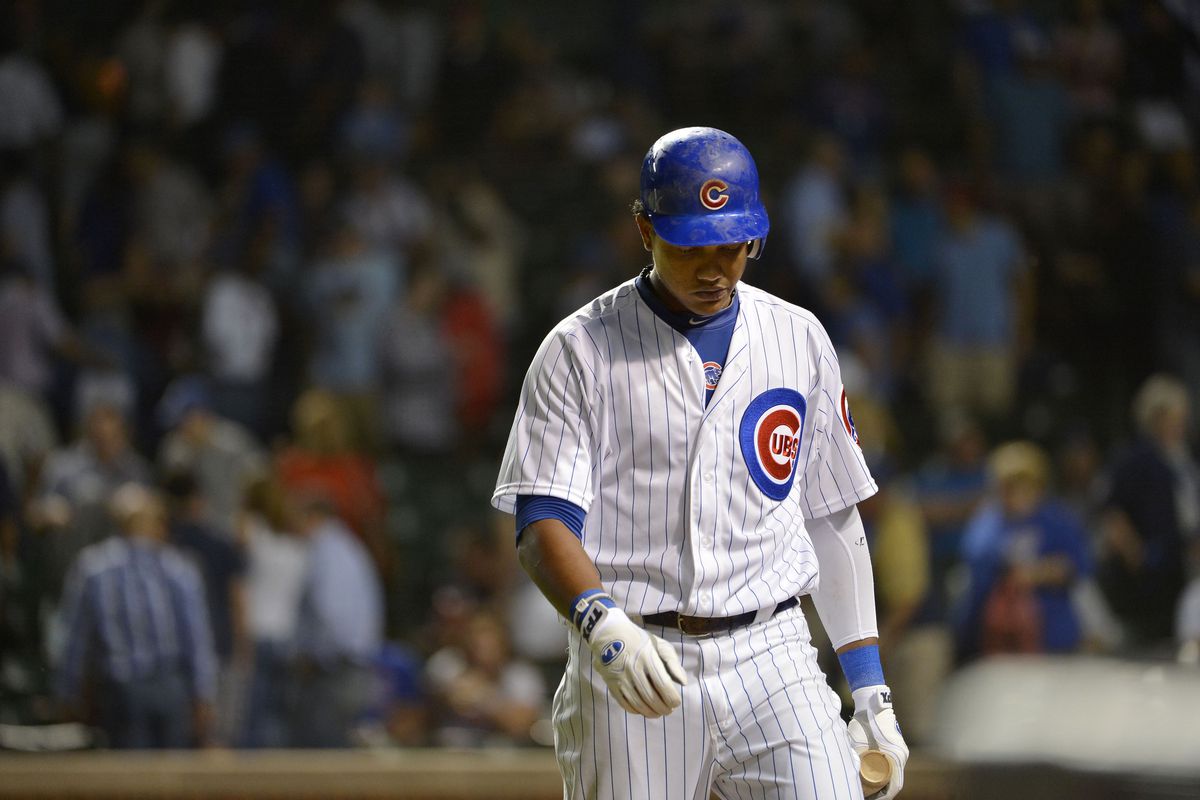 Starlin Castro of the Chicago Cubs walks off the field after striking out to make the final out against the Milwaukee Brewers at Wrigley Field in Chicago, Illinois. The Brewers defeated the Cubs 4-1. (Photo by Brian Kersey/Getty Images)