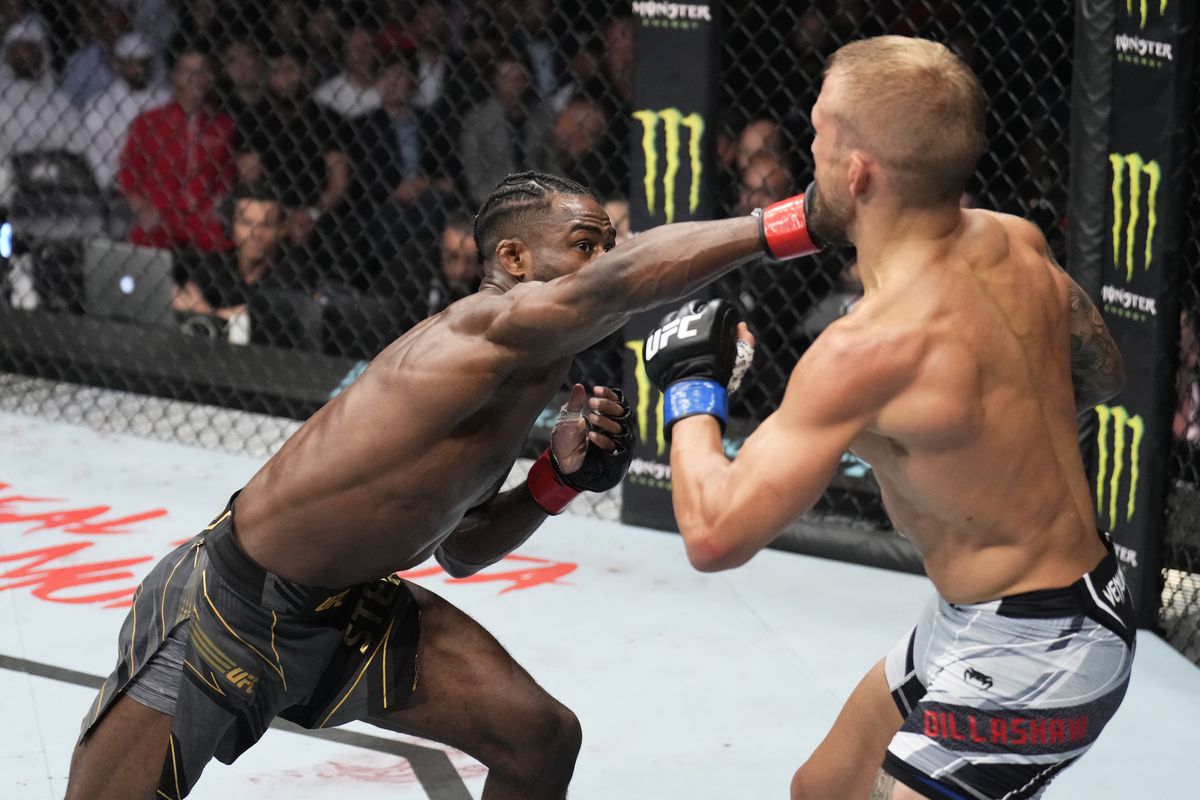 TJ Dillashaw eats a right hand from UFC champ Aljamain Sterling at UFC 280.