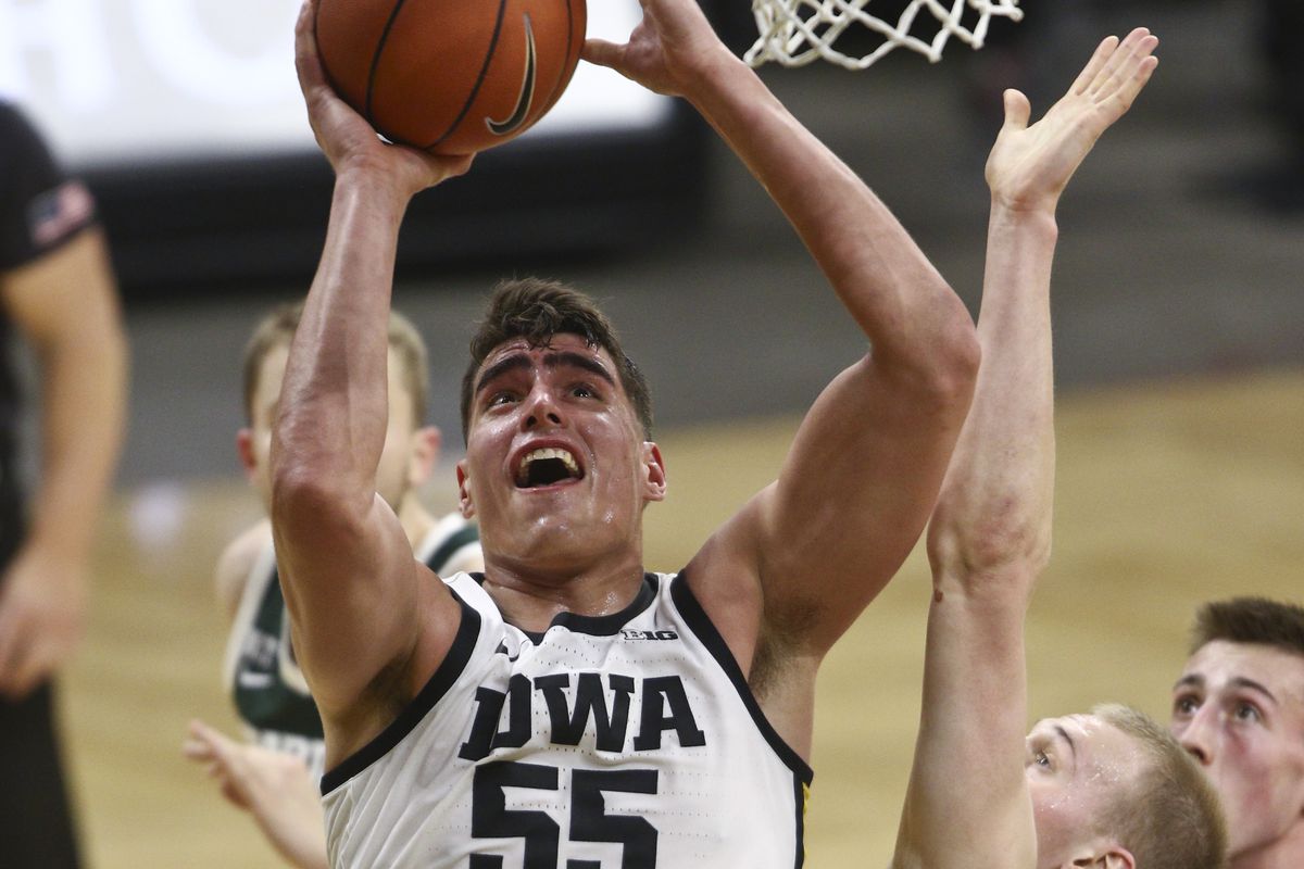Forward Luka Garza of the Iowa Hawkeyes shoots against forward Joey Hauser of the Michigan State Spartans during the second half at Carver-Hawkeye Arena on February 2, 2021 in Iowa City, Iowa.