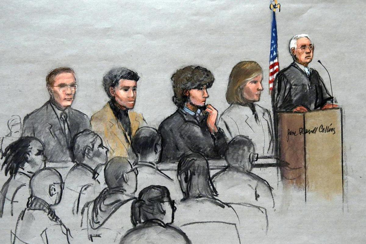 In this courtroom sketch, Boston Marathon bombing suspect Dzhokhar Tsarnaev, third from right, is depicted with his lawyers and U.S. District Judge George O'Toole Jr., right, as O'Toole addresses a pool of potential jurors in a jury assembly room at the f