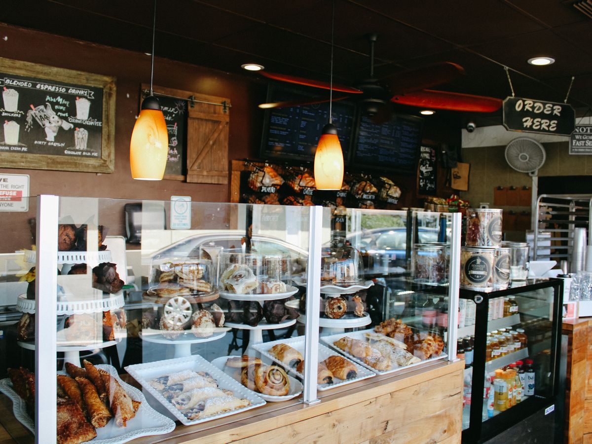A pastry case and counter at Rekindle Caffee.