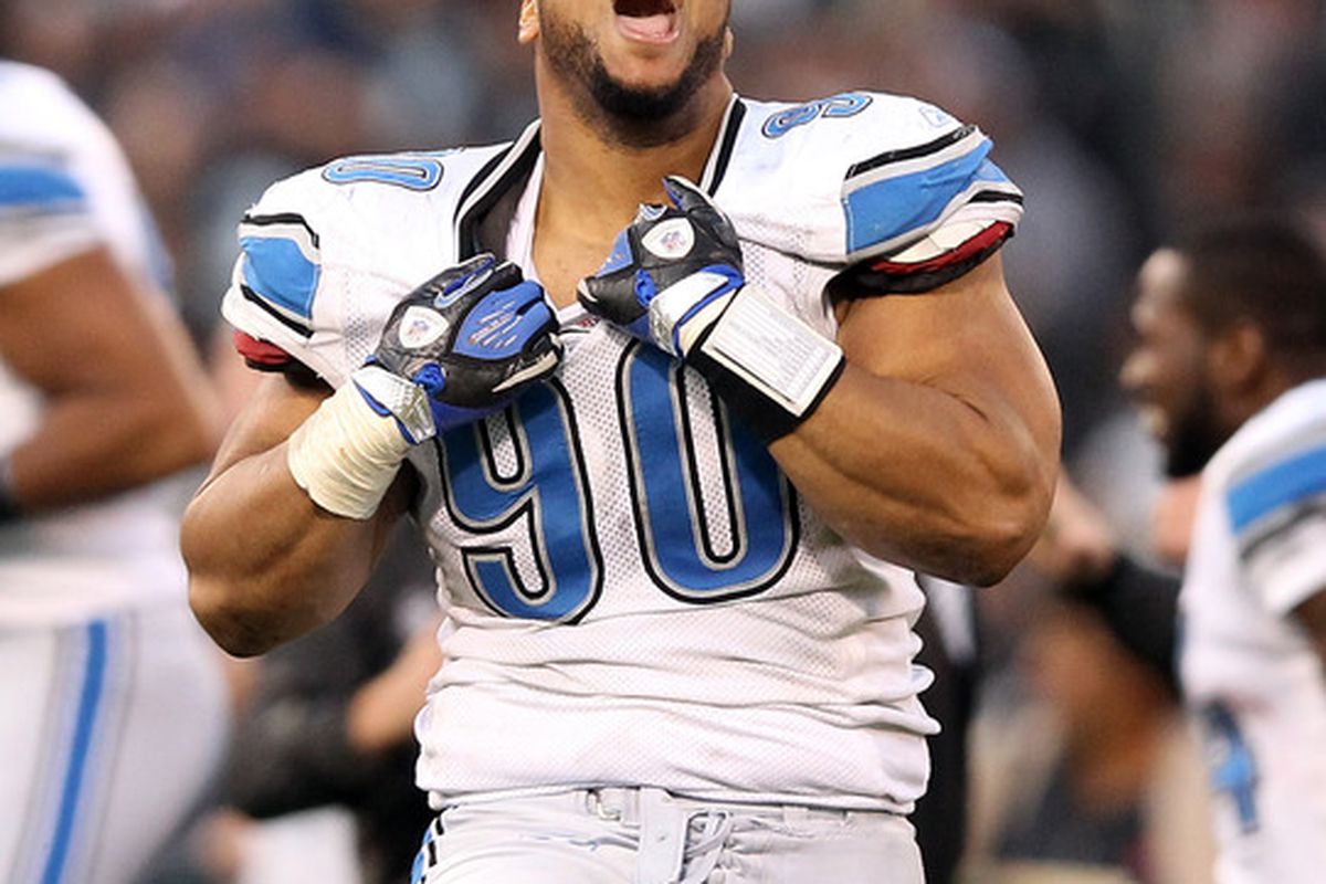 OAKLAND, CA - DECEMBER 18:  Ndamukong Suh #90 of the Detroit Lions celebrates after they came from behind to beat the Oakland Raiders at O.co Coliseum on December 18, 2011 in Oakland, California.  (Photo by Ezra Shaw/Getty Images)