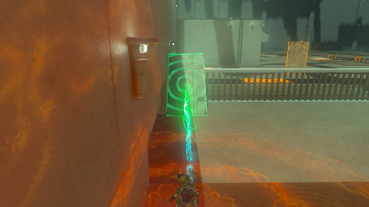 Link creating a ramp using a wooden plank in the Kudanisar Shrine in the Legend of Zelda: Tears of the Kingdom.
